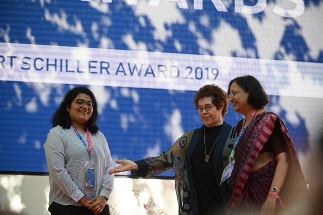 Pooja Ichplani (L) and Archna Kumar received the award from Janet Wasko