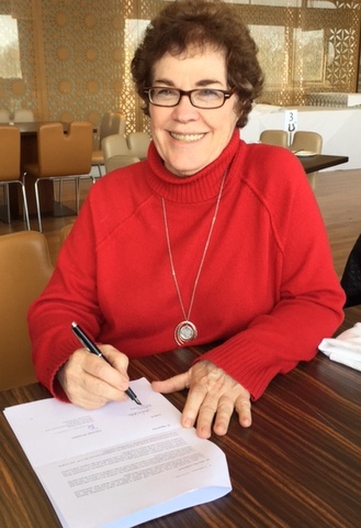 IAMCR President Janet Wasko signing the agreement with the University of Leicester