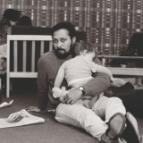 Stuart Hall holding a baby 